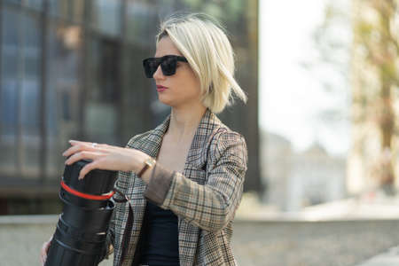 Businesswoman is going to close the architecture bag while thinking about the plansの写真素材