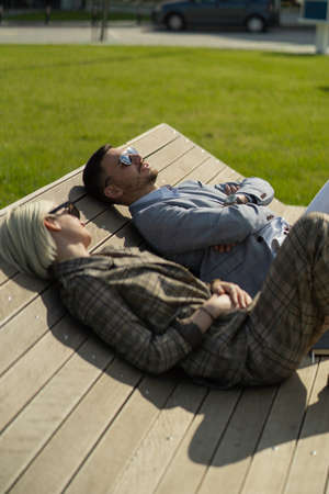 Well dressed business people are having a conversation on the benchの写真素材