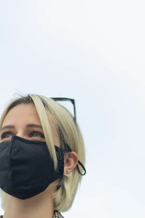 Close up portarit of businesswoman with protection mask from covid-19の写真素材