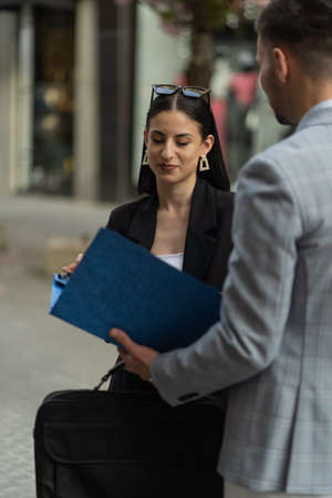 Two business people are having a conversation about the new company plansの写真素材