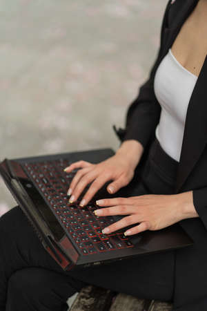 Close up portrait of hands working on the laptopの写真素材