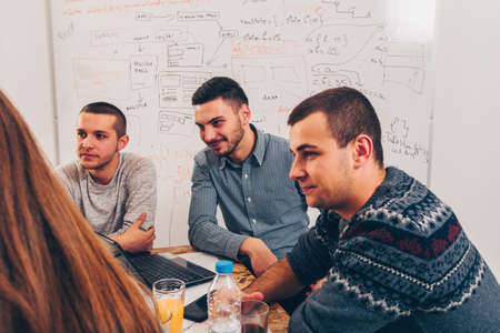 Group of succesfull people are discussing indoorsの写真素材