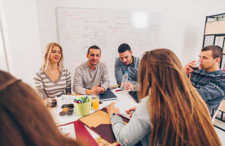 Group of young business people are having a meeting in the corporate