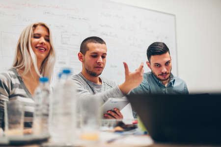 Group of young business people are having a meeting in the corporate