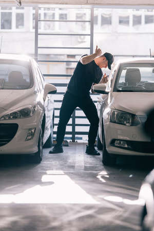 Thief is trying to rob a car with jemmyの写真素材