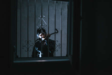 The burglar trying to break into someone's homeの写真素材