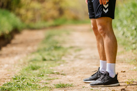 Sport man running. Portrait of runner man jogging in park. Sport workout outdoor. Athlete training...