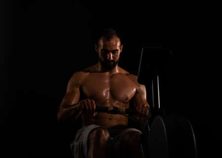 Strong and handsome guy is exercising so hard while being topless