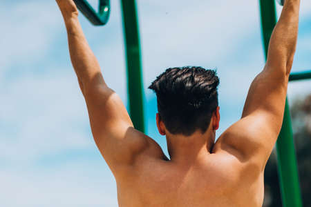 Handsome powerful muscular man showing his body musclesの写真素材
