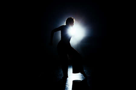 ontemporary dancing performer in a dance practice class