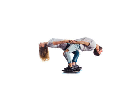 Two trainers are doing warm up for training