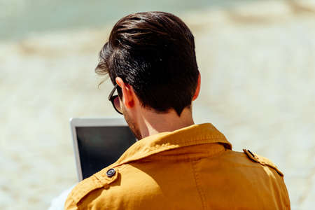Good looking businessman looking at his tablet