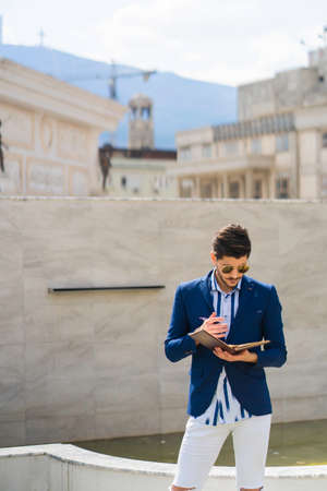 Businessman is looking through the work plans he had made so farの写真素材