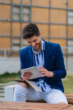 Businessman is miling about the work plans for his companyの写真素材