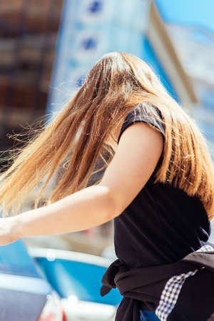 Portrait close up of young beautiful haired woman on summer sceneの写真素材