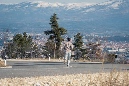 Runner man running in winter on cold day wearing long tights and long sporty jogging outfitの写真素材