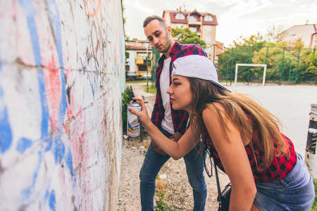 Two urban friends are sprending quality time together and fooling aroundの写真素材