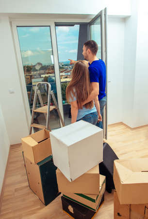 Lovely married couple enjoying in the view of their new apartment