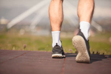 Male sportsman feet from close up and low angelの写真素材