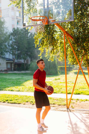 Basketball player jump shooting and playing basketball.