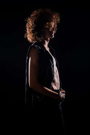 Studio body shot of a fashion male model wearing stylish clothesの写真素材