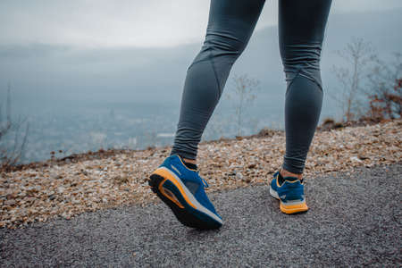 Healthy fit middle aged runner during a warm up routine before runningの写真素材