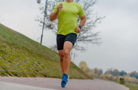 Mature muscular man dressed in sportswear doing a jogging exerciseの写真素材