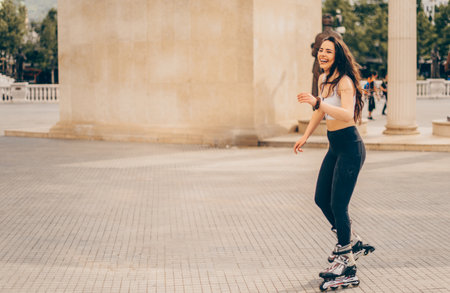 A girl is roller skating and enjoying the beautiful weather
