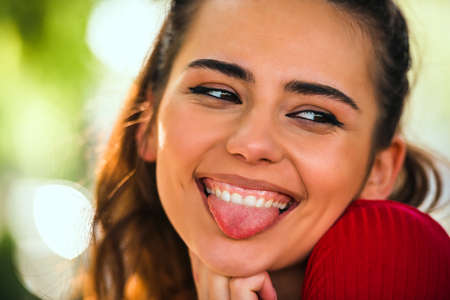 Close up portrait of a happy young Caucasian woman smilingの写真素材