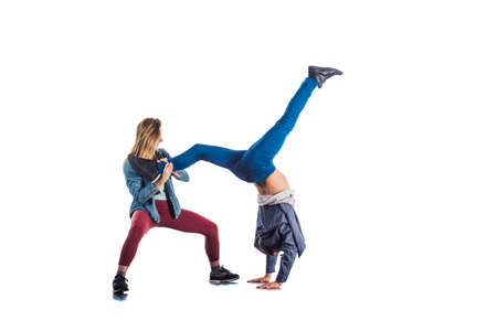 Handsome man is doing handstand aerobic exercise