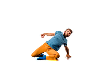 Amazing dancer is doing breakdance on a white backgroundの写真素材