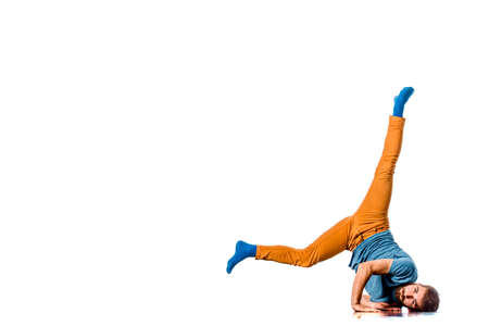 Young handsome dancer in motion is dancing in the studioの写真素材