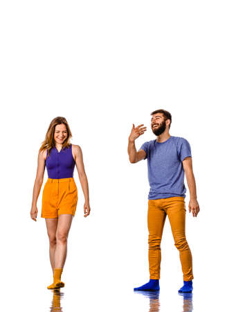 Attractive couple dancing social dance. Couple of young man and woman dancing hip-hop isolated on white backgroundの写真素材