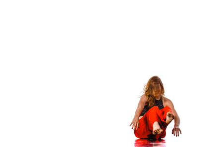 Young blonde jazz dance aerobics female instructor dancing motion looking away