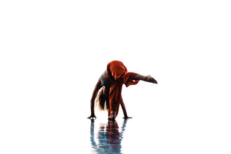 Stylish young woman performing an elegant dance choreography