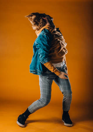 Muscular young guy practicing modern style dance posesの写真素材