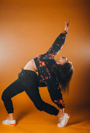 Artistic dance moves performed by an young sporty girlの写真素材