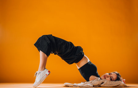 Artistic dance moves performed by an young sporty girlの写真素材