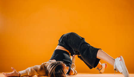 Modern dancing performer doing acrobat skills during a dance practiceの写真素材
