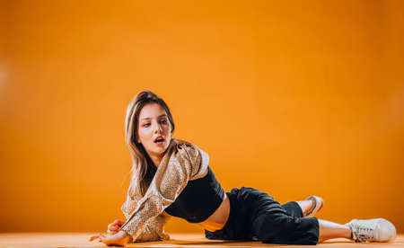 Dance moves performed by an acrobatic flexible female dancerの写真素材