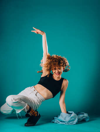Female dance dancer exercising poses during a dance practiceの写真素材