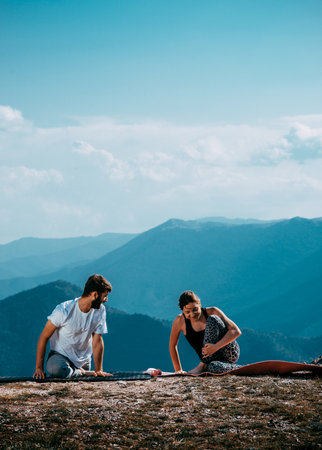 Balance your life. Young couple meditating together while doing yoga. Yoga concept. Healthy...