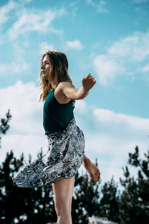 Full length view of a couple of female and male urban dancers performing and freestyling with some musicの写真素材