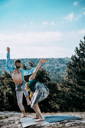 Summer holidays, teenage and dancing concept - couple of teenagers dancing outsideの写真素材