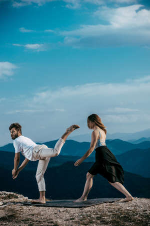 Attractive couple dancing hip-hop. Skillful modern style teenagers dancing contemporary danceの写真素材