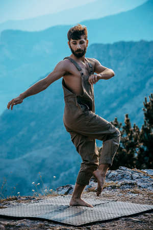 Full length portrait of excited happy cheerful positive handsome dancing young manの写真素材