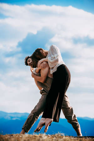 Sensual couple performing an artistical and emotional contemporary danceの写真素材