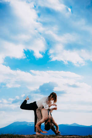 Hip-hop dancers in action. Young couple of casual dancers performing modern danceの写真素材