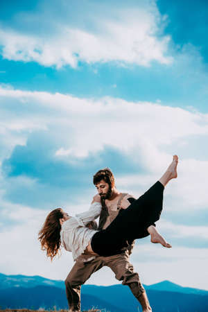 Two modern dancers couple teen woman and man dancing on peak Urban lifestyle. Hip-hop generationの写真素材