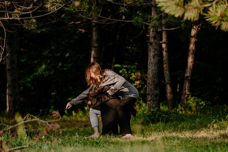 Romantic couple dancing and smiling outside on the meadowの写真素材